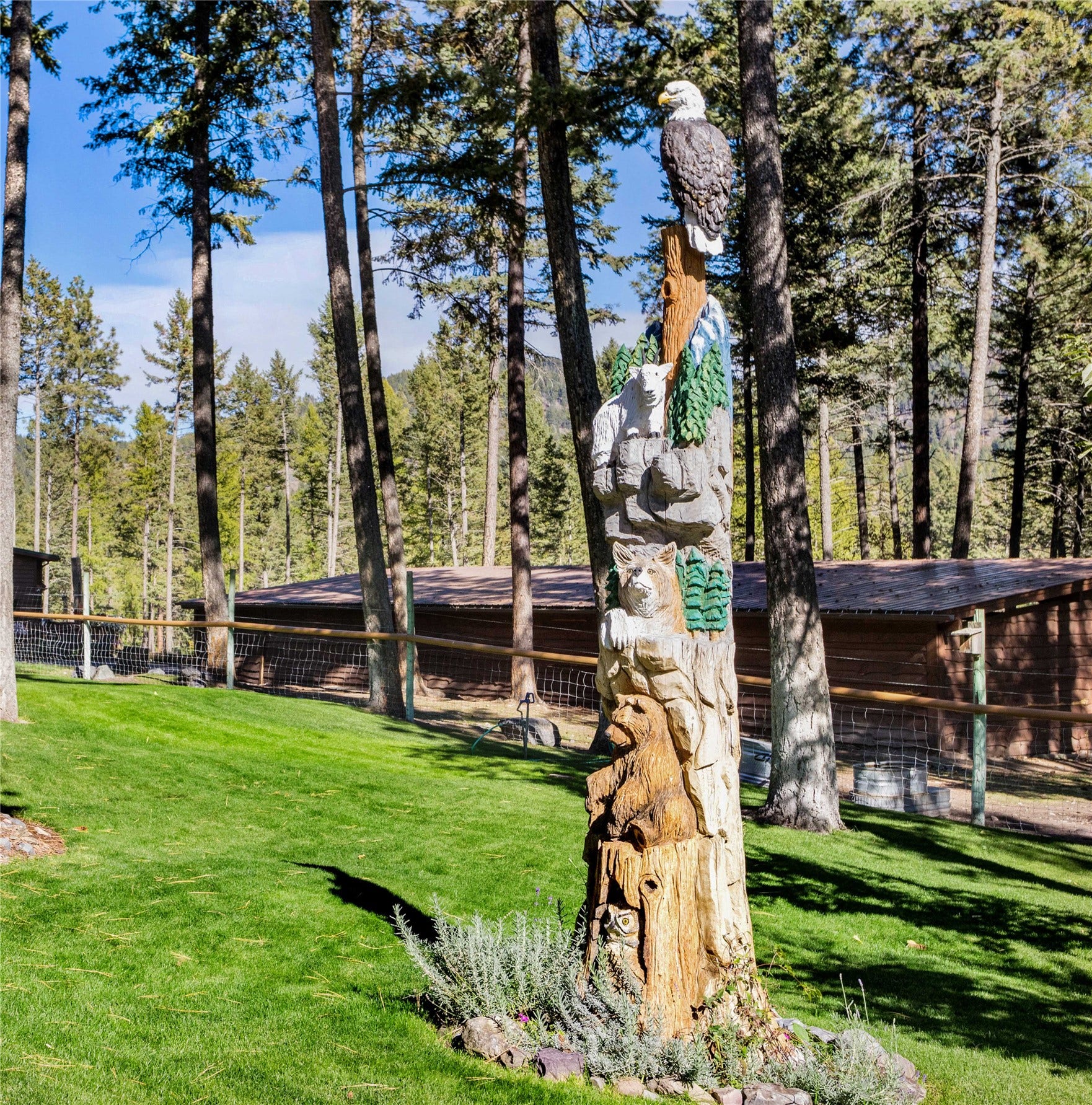 13518 Sylvan Drive, Bigfork, MT 59911 Looking towards garage, Bunk House and outbuildings