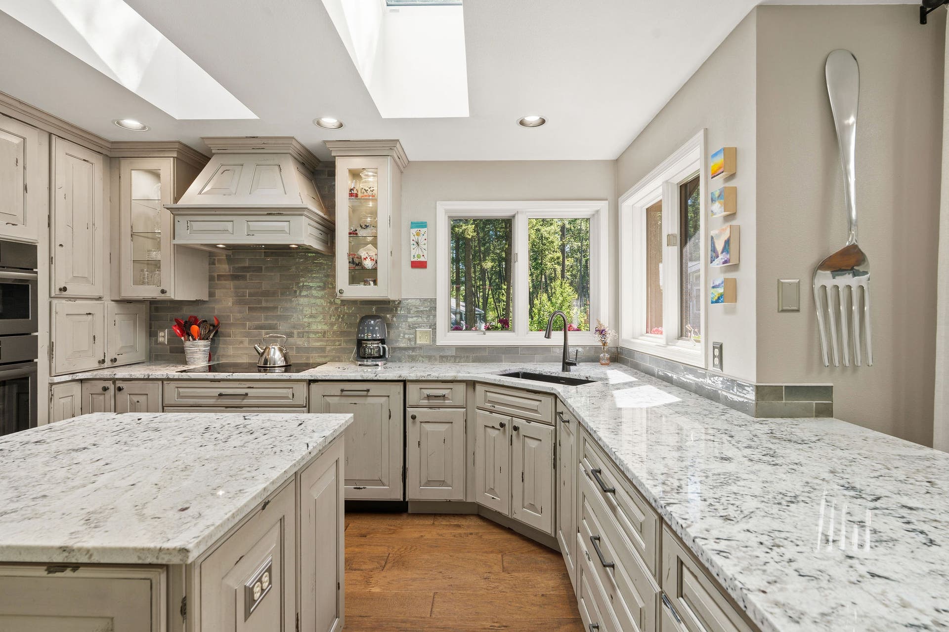 188 Eagle Bend Drive, Bigfork, MT 59911 Granite countertops and plenty of prep space with abundant natural light in the kitchen