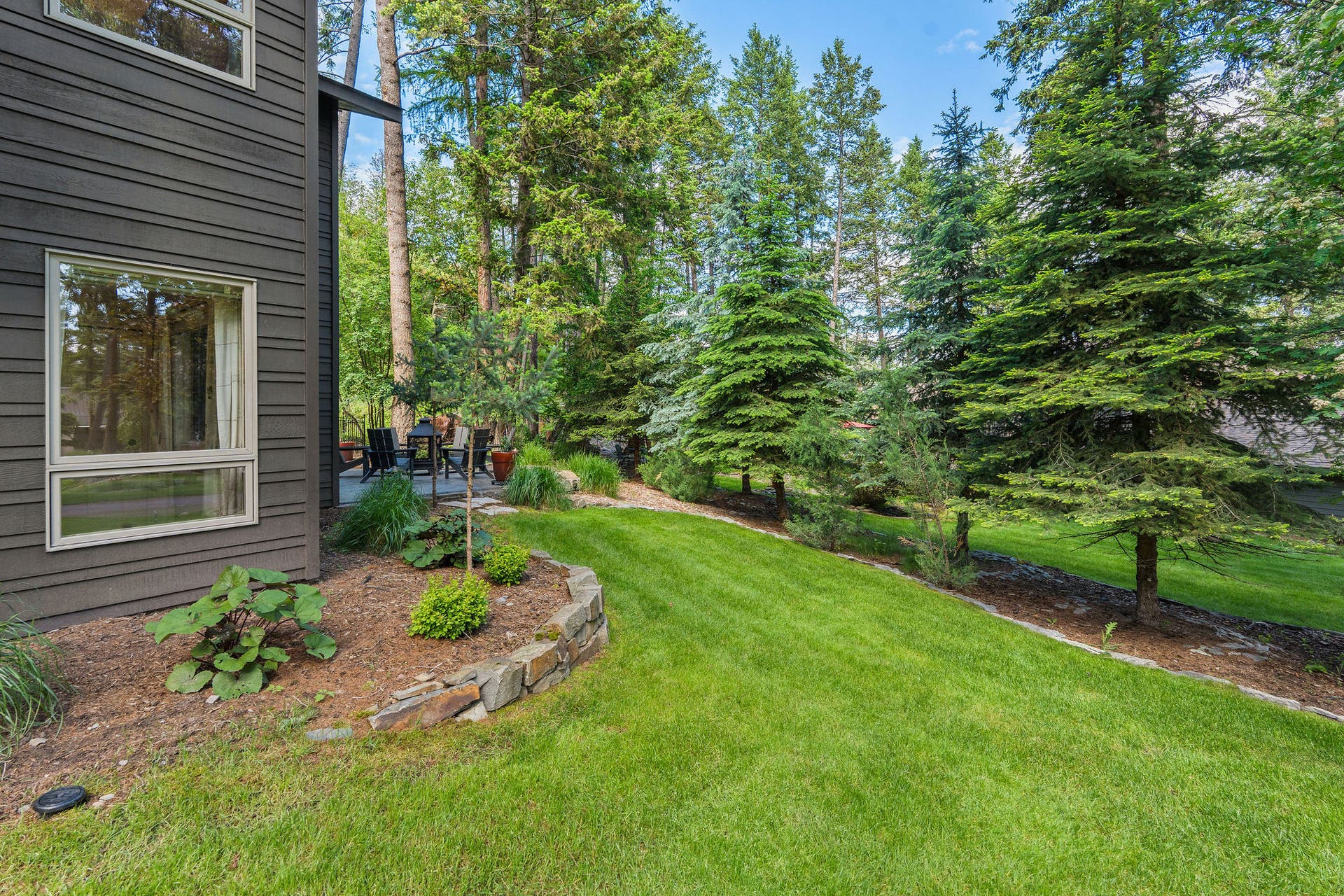 188 Eagle Bend Drive, Bigfork, MT 59911 Beautiful yard and landscaping wrap around to the perfect eveing entertaining space...