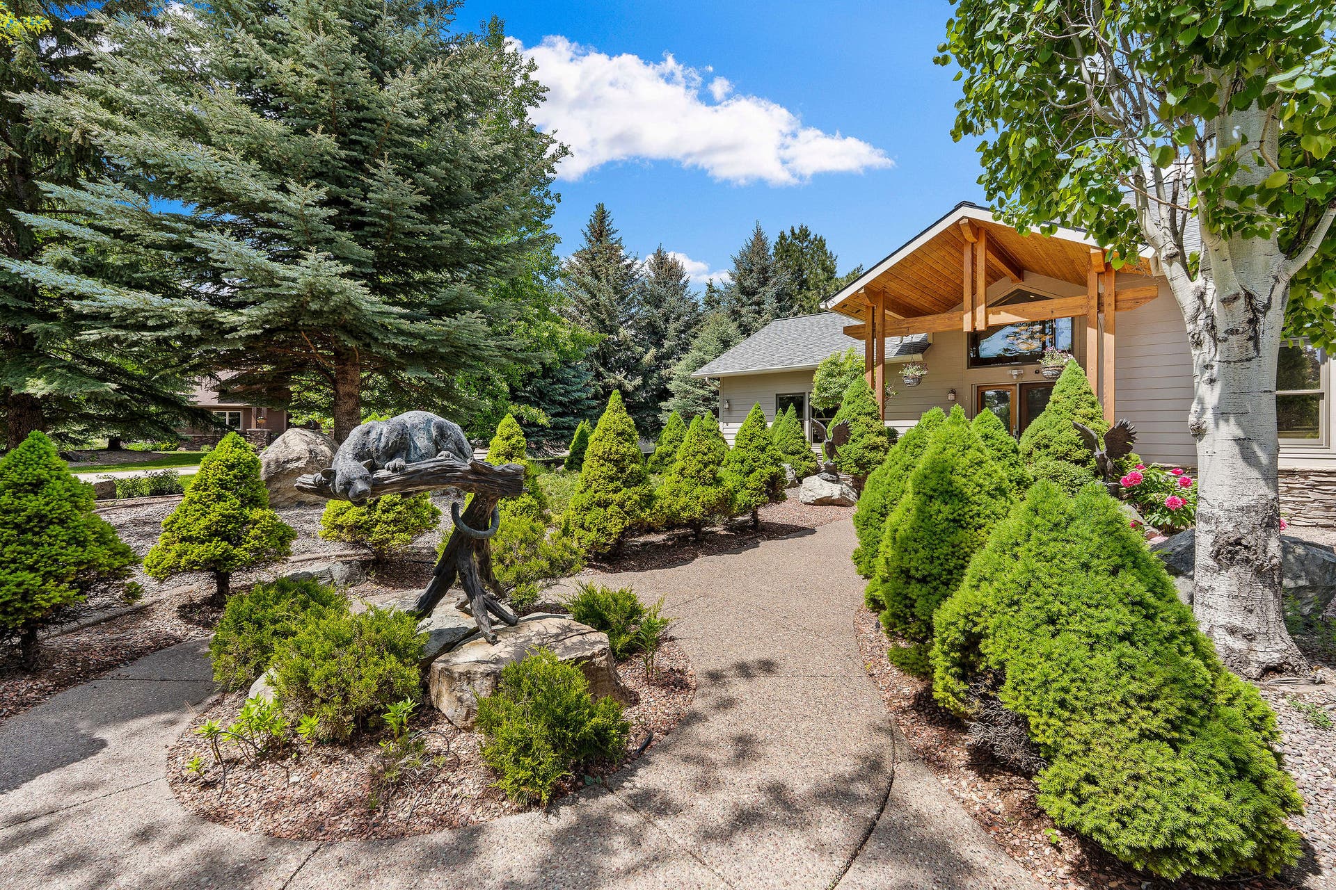 229 Harbor Drive, Bigfork, MT 59911 Front courtyard with manicured shrubs
