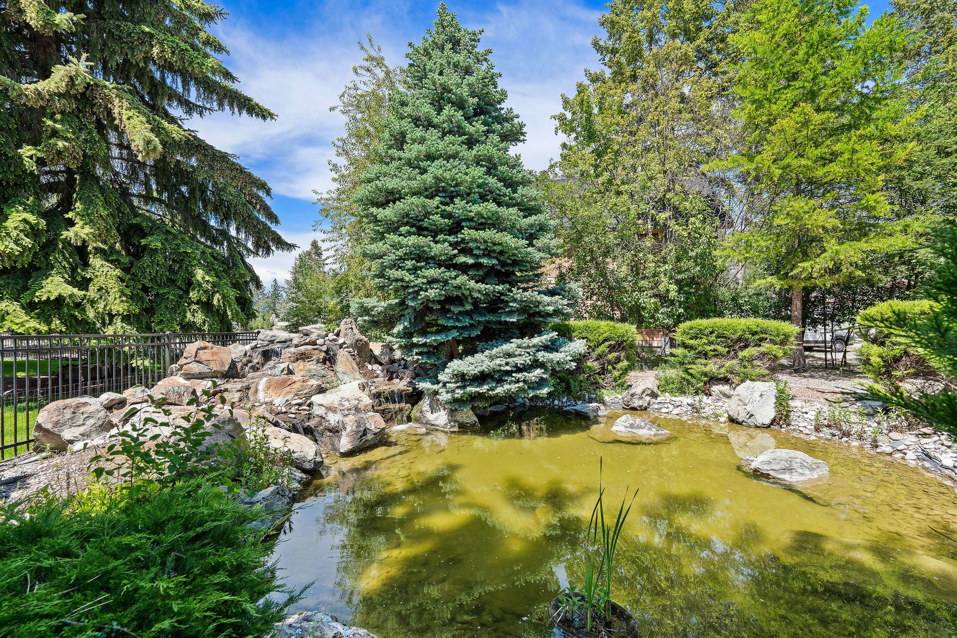 229 Harbor Drive, Bigfork, MT 59911 Back courtyard with waterfall feature