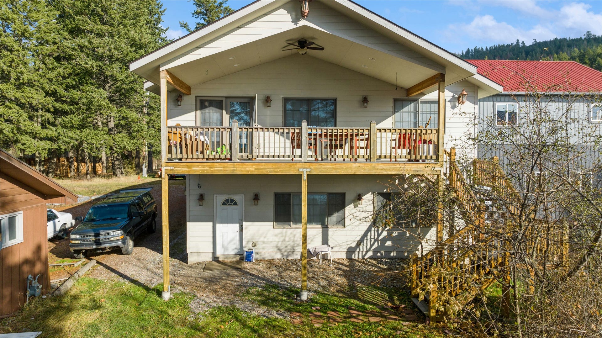 15236 Mt Highway 35, Bigfork, MT 59911 Looking W to E at entrance to guest quarters off original main house.