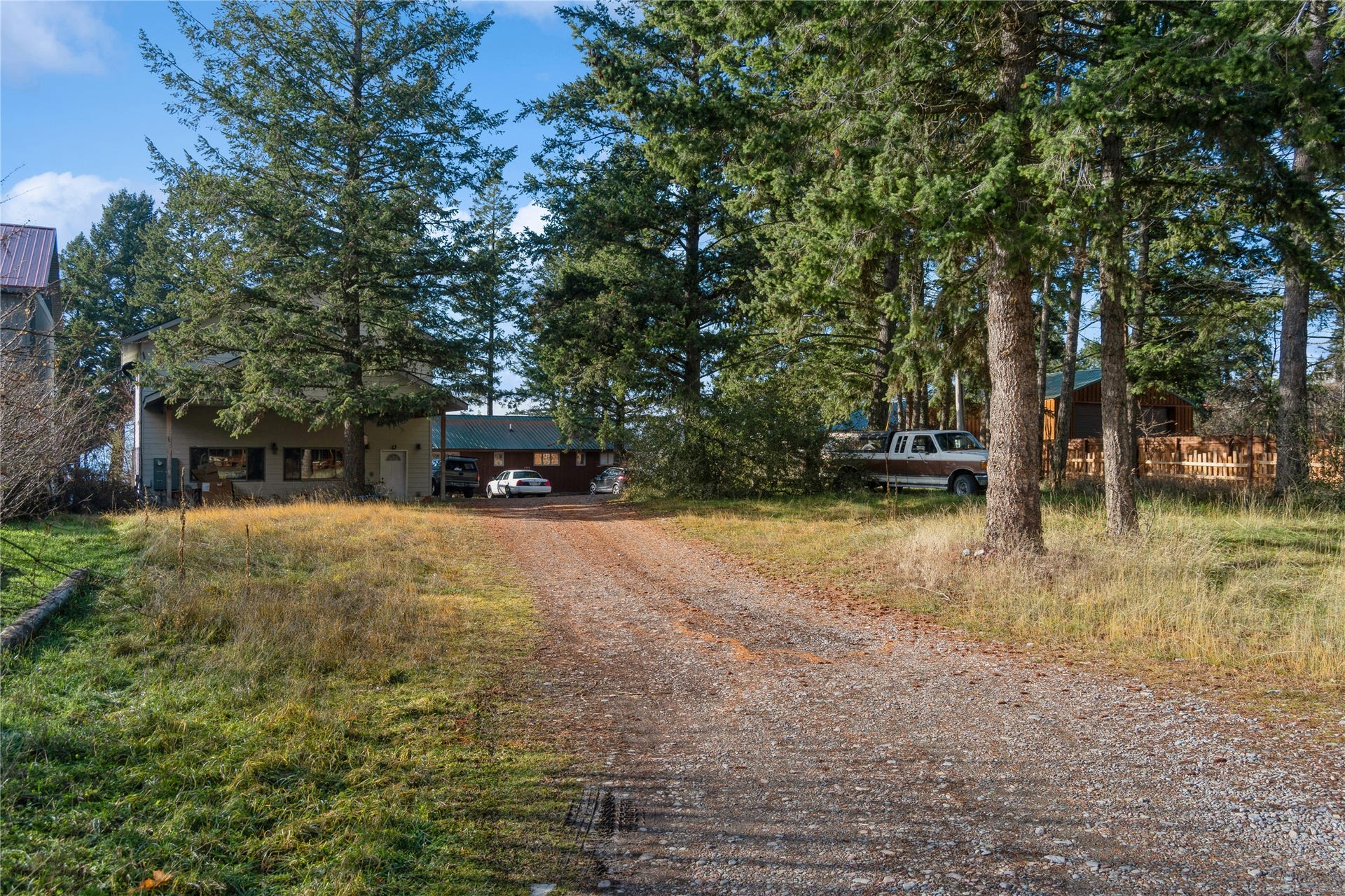 15236 Mt Highway 35, Bigfork, MT 59911 Driveway entrance from Shore Acres looking W towards guest quarters and main original residence.