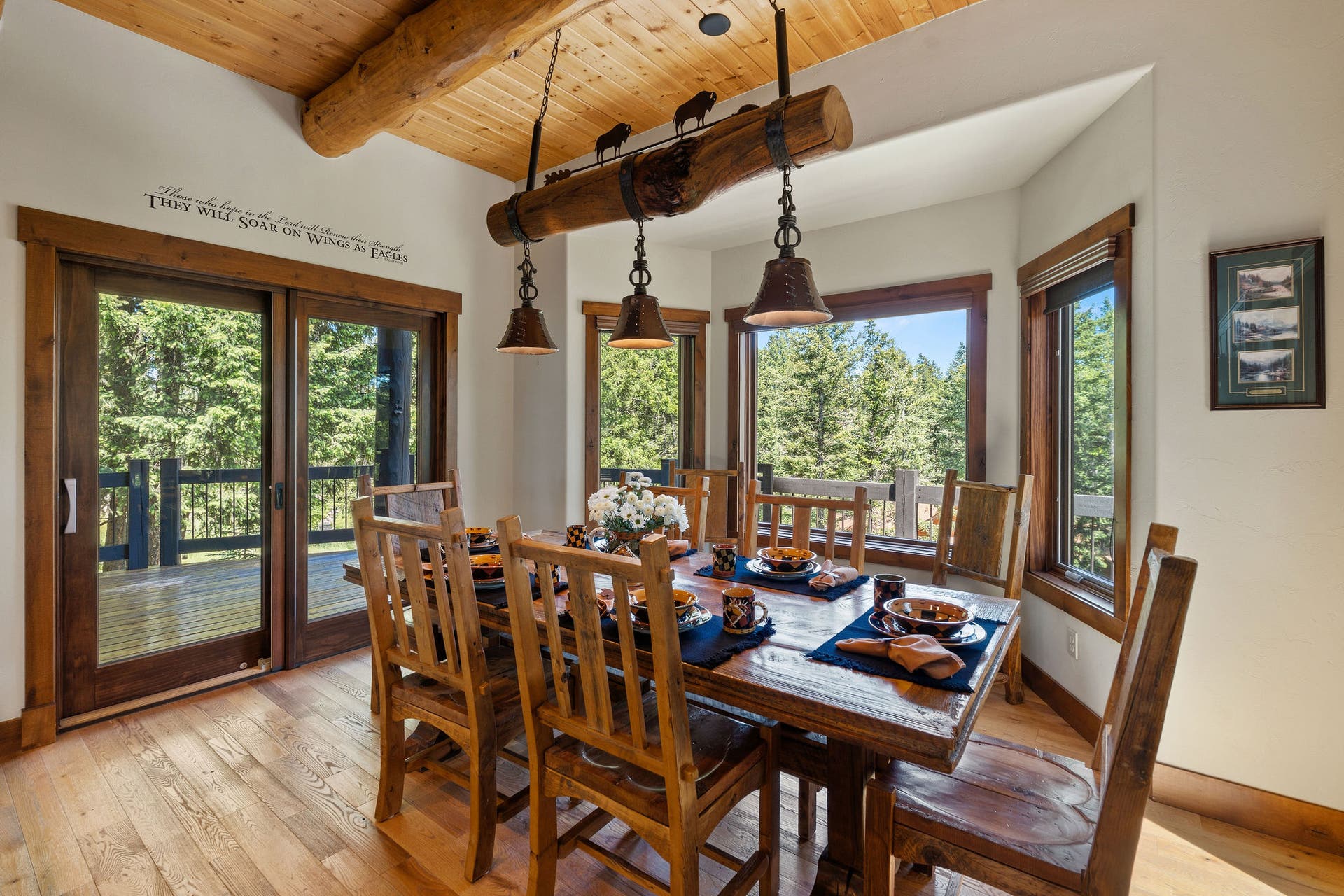 129 Bjork Drive, Bigfork, MT 59911 Exterior sliding glass doors to deck, bay window, custom chandelier
