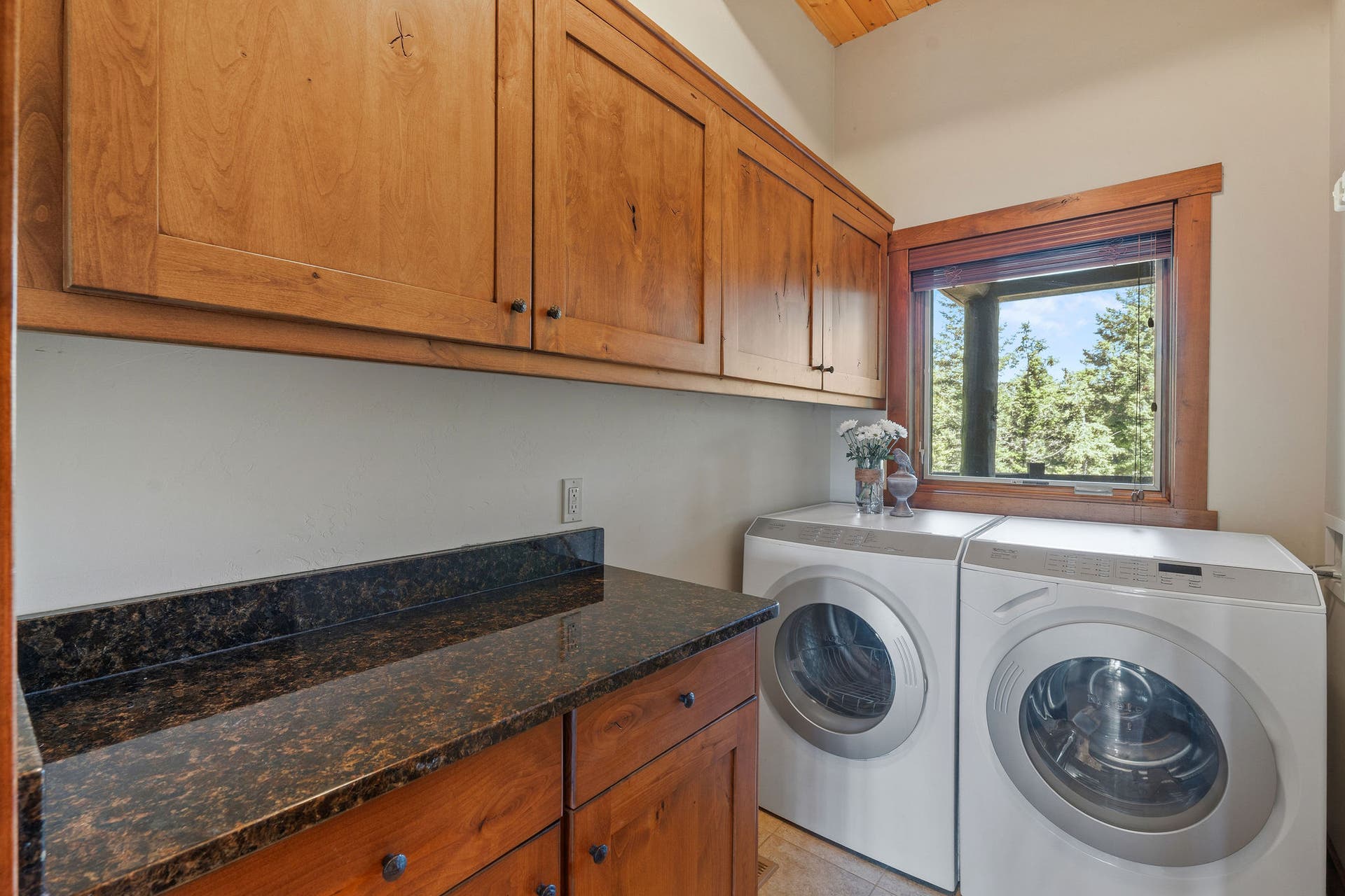 129 Bjork Drive, Bigfork, MT 59911 Granite countertop, Miele washer/dryer, tile floor, knotty alder cabinets