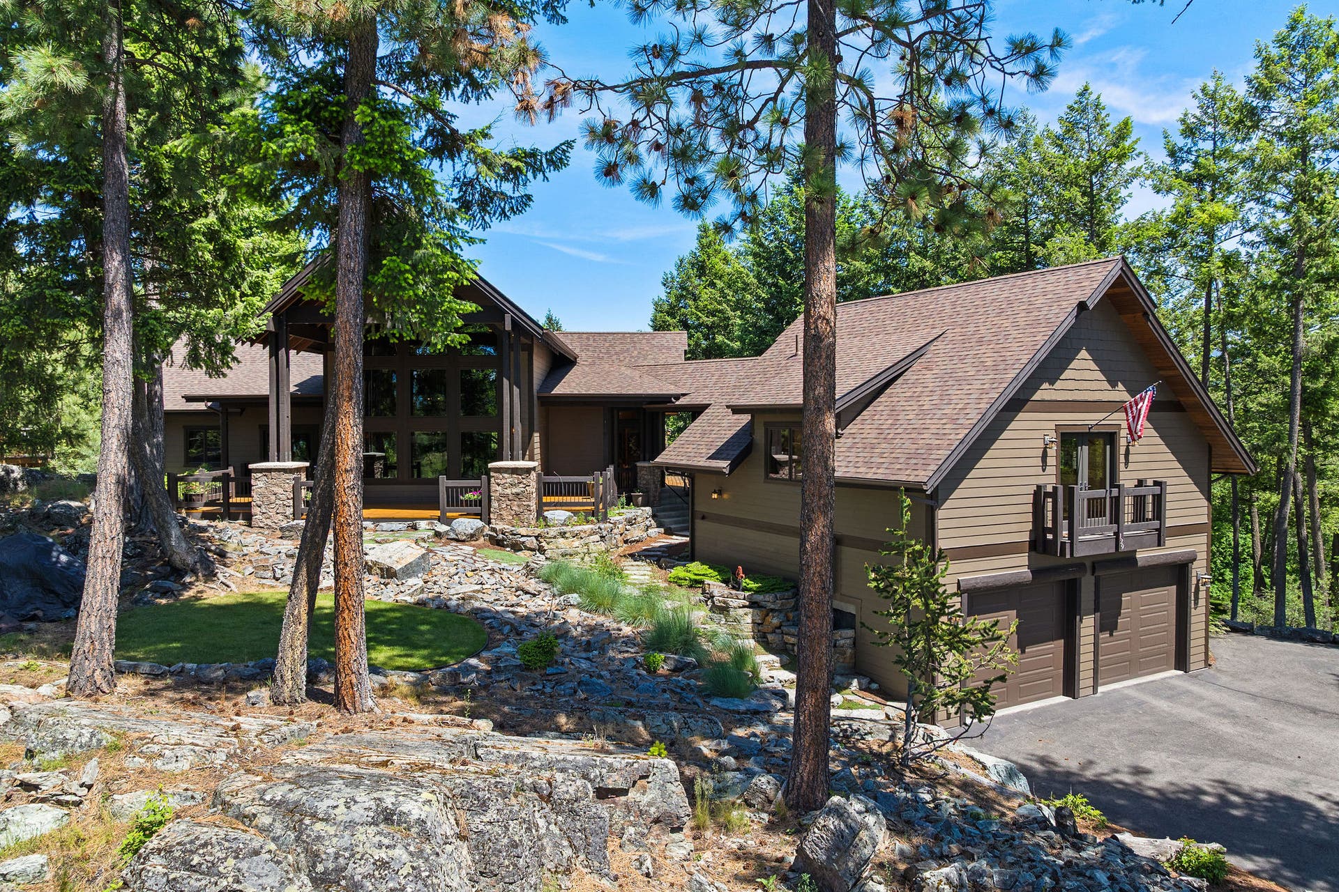 129 Bjork Drive, Bigfork, MT 59911 4,015 SF, surrounded by pine trees