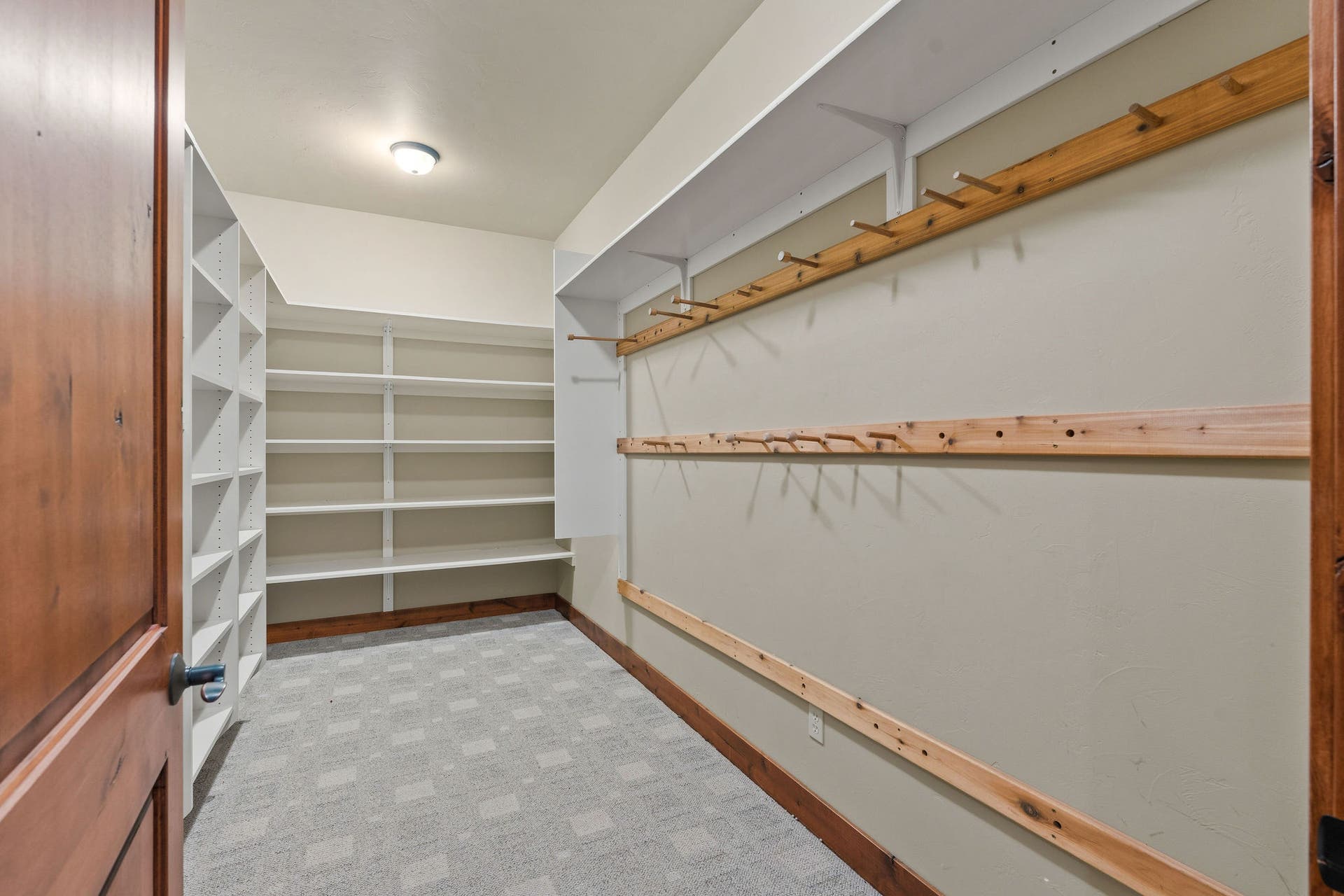 129 Bjork Drive, Bigfork, MT 59911 Large storage room with built-in shelving & hanging rods