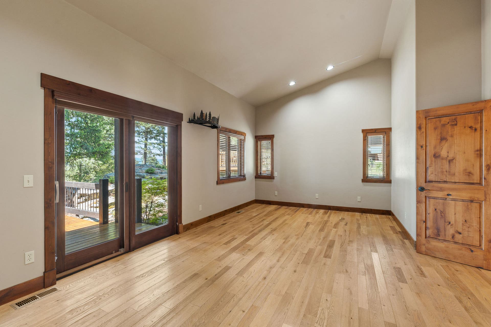 129 Bjork Drive, Bigfork, MT 59911 Pine floor with rare long needle pine, cathedral ceiling, glass sliding door to deck