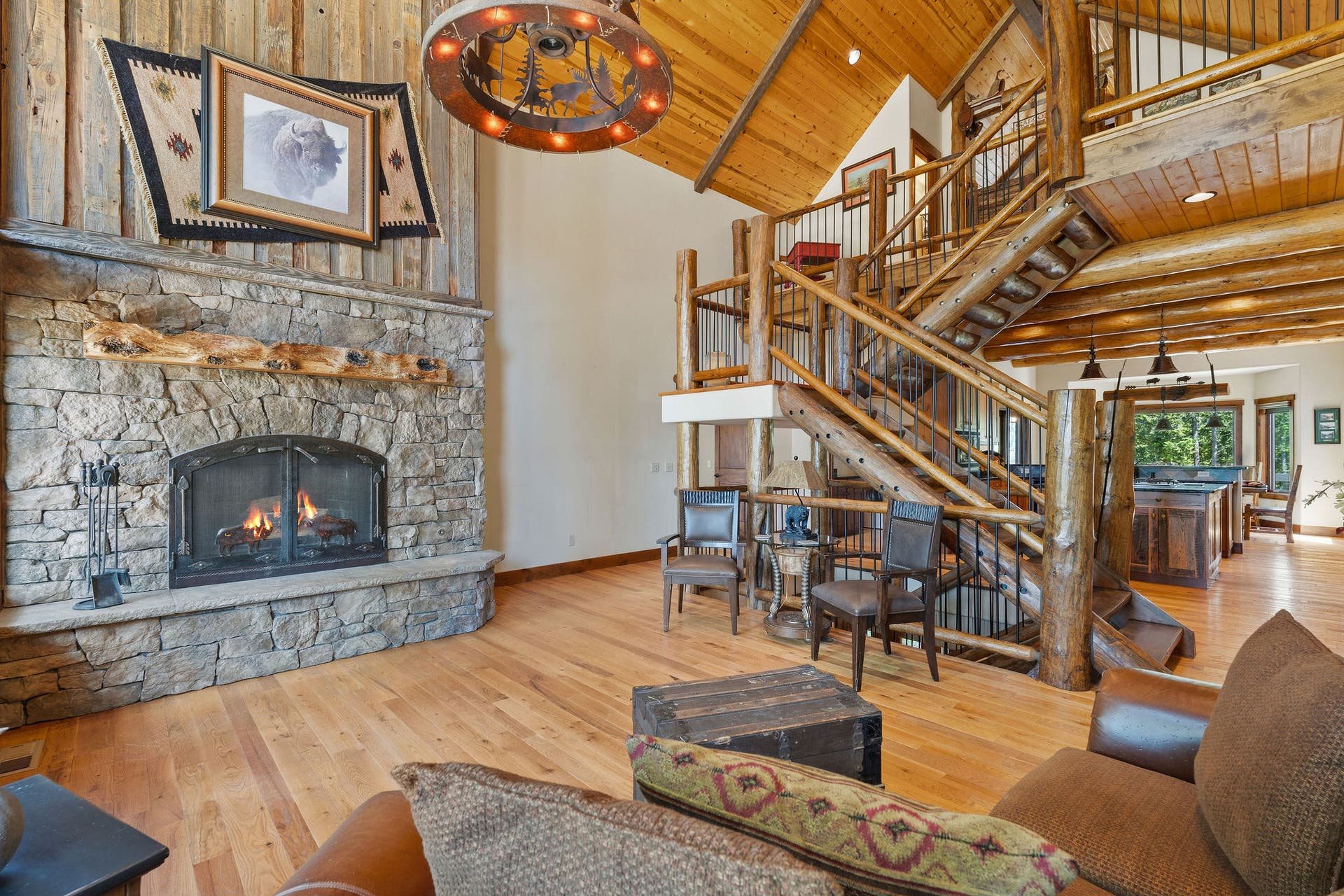 129 Bjork Drive, Bigfork, MT 59911 Rock wood-burning fireplace with barnwood wall & handmade screen, hardwood floors