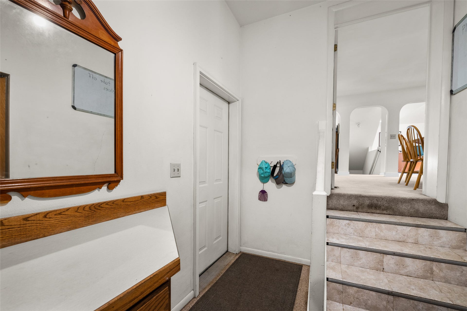 182 Crestview Drive, Bigfork, MT 59911 Left to right view: Garage Door, Stairs up to Kitchen from Laundry Room