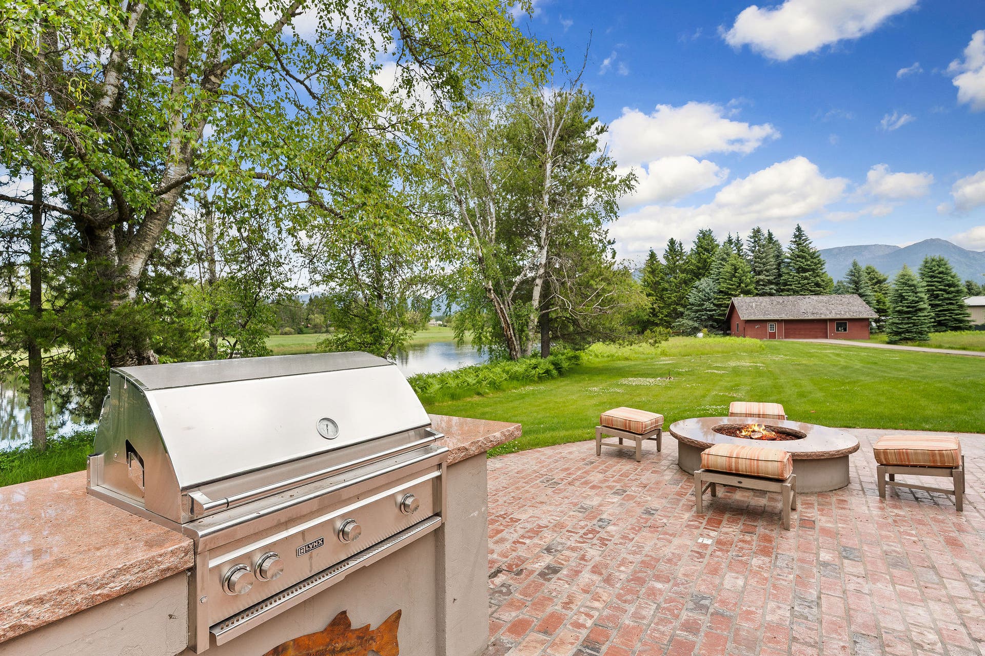 1160 Swan Horseshoe Drive, Bigfork, MT 59911 Both Barbeque grill and firepit are directly connected to the propane tank for easy and continual use.