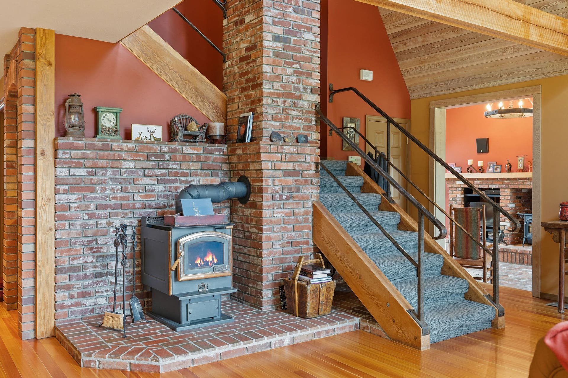 1160 Swan Horseshoe Drive, Bigfork, MT 59911 Gas stove and loft stairs in living area