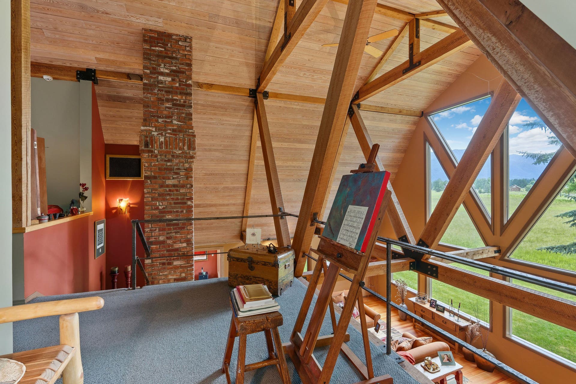 1160 Swan Horseshoe Drive, Bigfork, MT 59911 Loft sitting area looking out toward the Swan Range