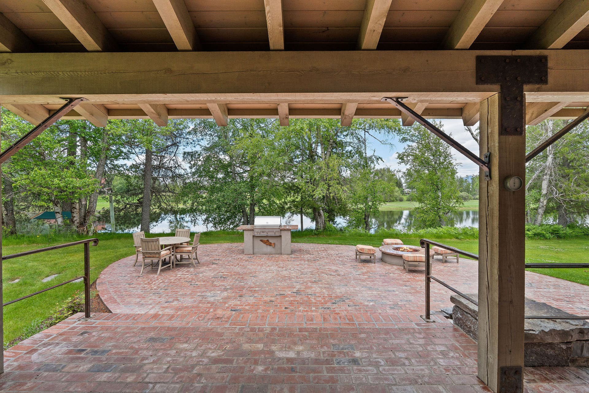 1160 Swan Horseshoe Drive, Bigfork, MT 59911 Covered back porch looking toward the river.