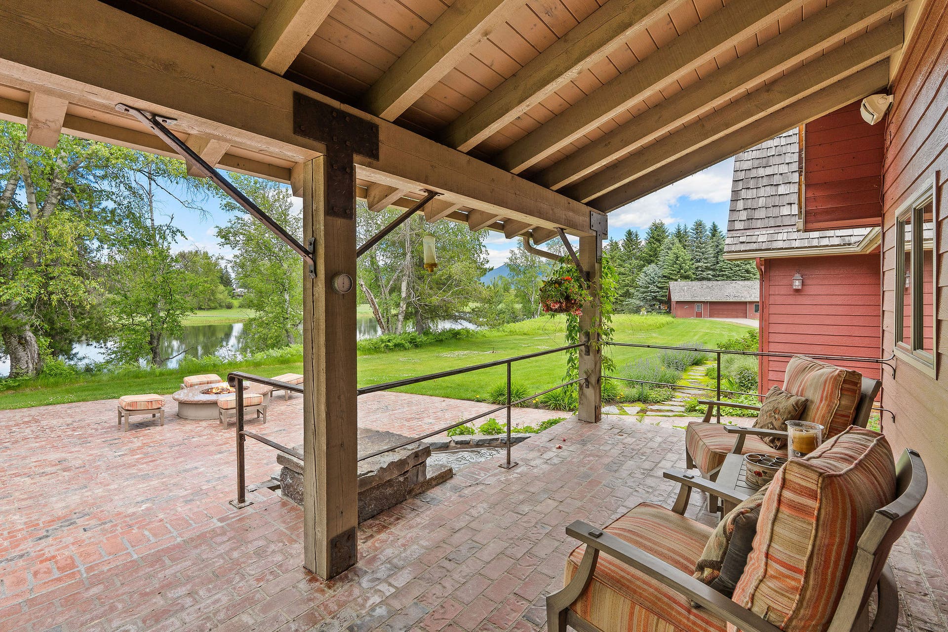 1160 Swan Horseshoe Drive, Bigfork, MT 59911 Back porch sitting area looking out on Swan River
