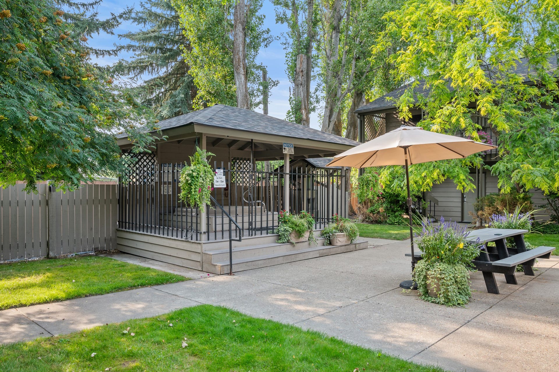 180 Vista Lane, #140, Bigfork, MT 59911 Beautiful courtyard with shared hot tub/BBQ/Picnic area just outside the front door.
