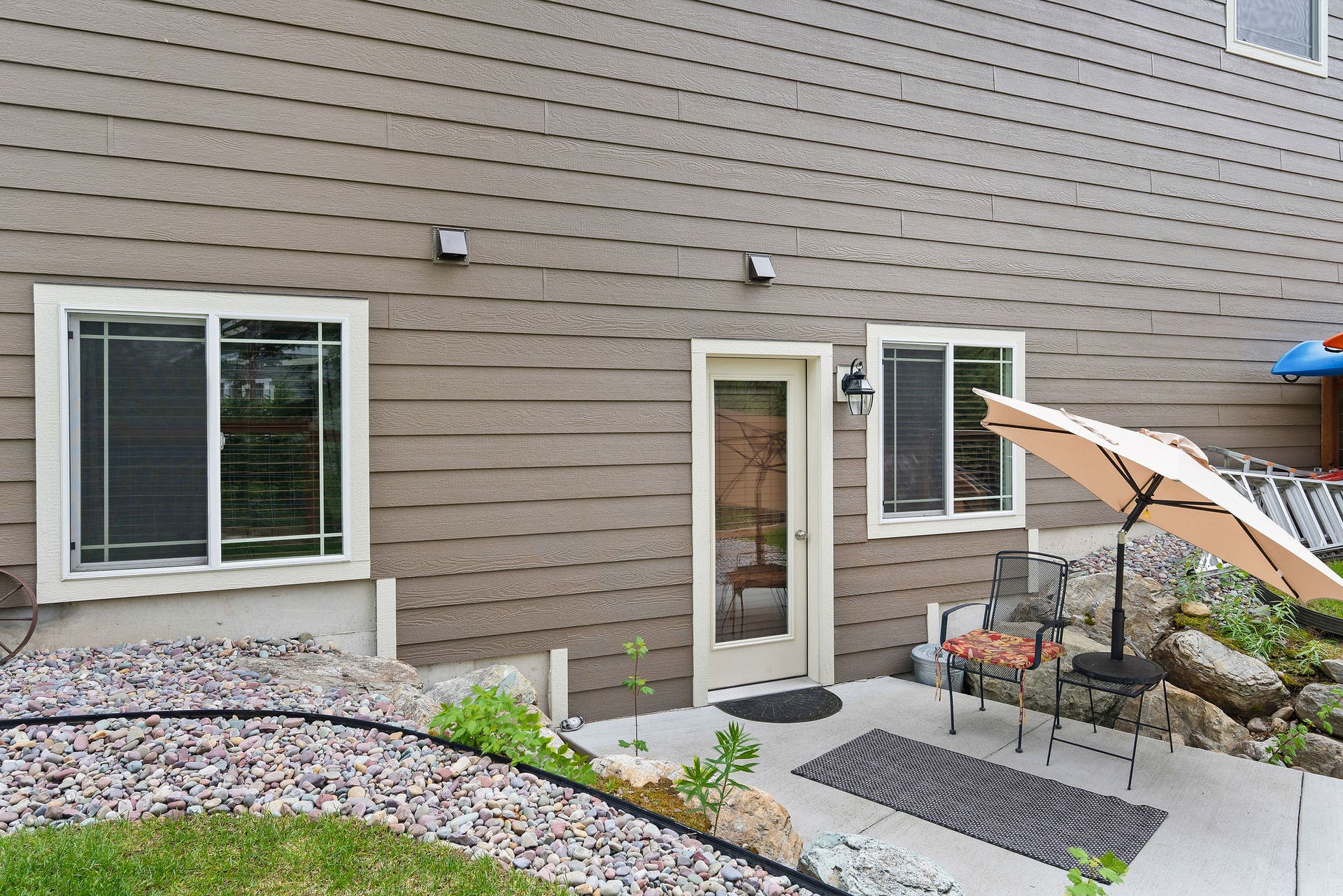 13404 Crescent Moon Drive, Bigfork, MT 59911 Private lower-level entrance with a dedicated patio sitting area