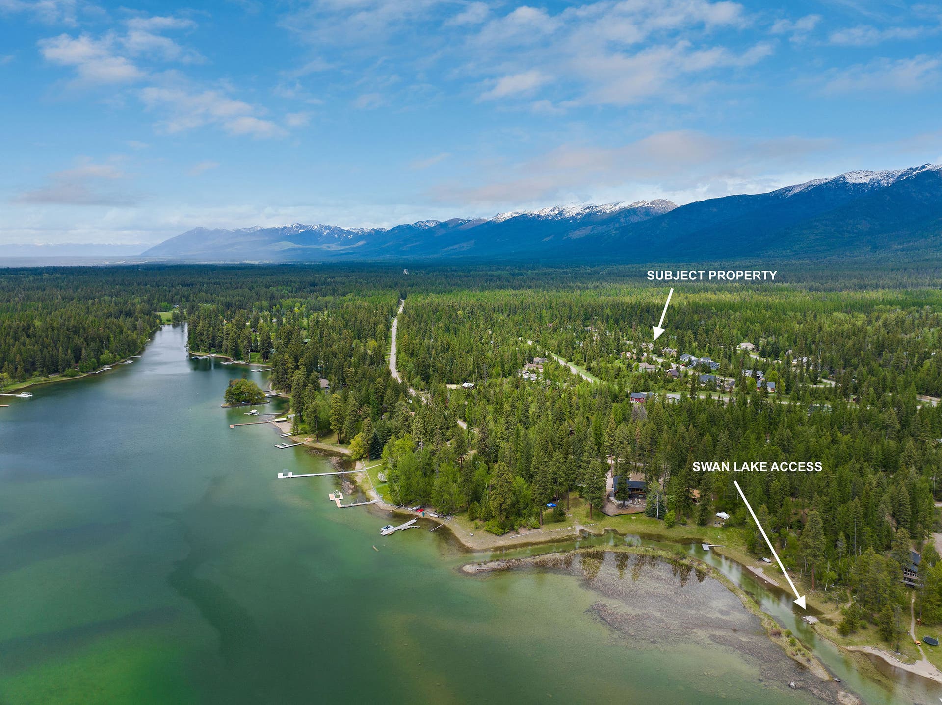 13404 Crescent Moon Drive, Bigfork, MT 59911 Broad aerial perspective showing the subject property relative to Swan Lake and the community lake access