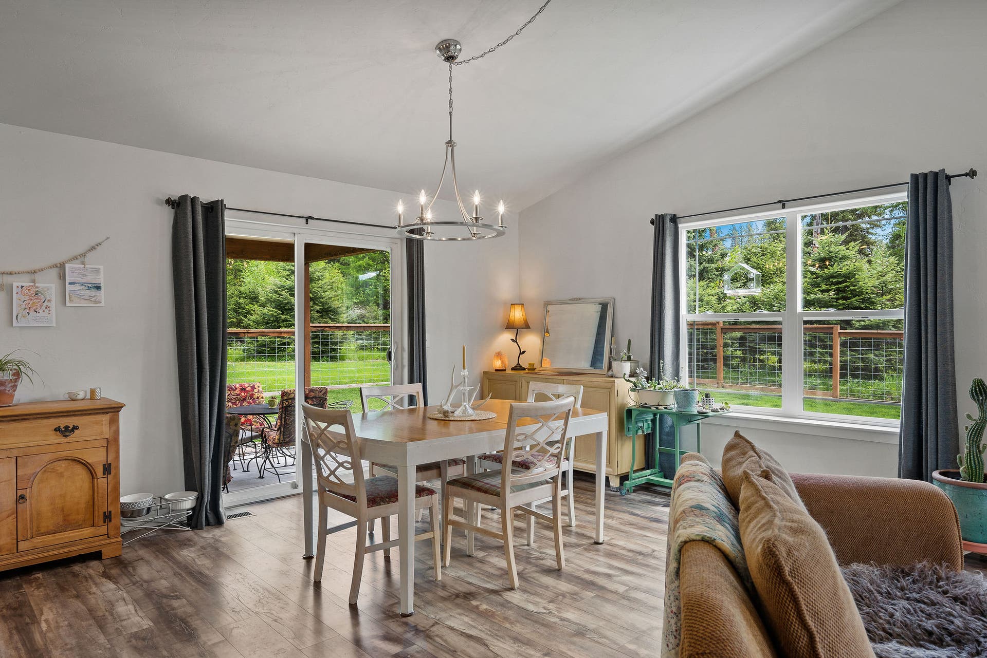 13404 Crescent Moon Drive, Bigfork, MT 59911 Bright dining area with a sliding glass door opening directly to the back patio