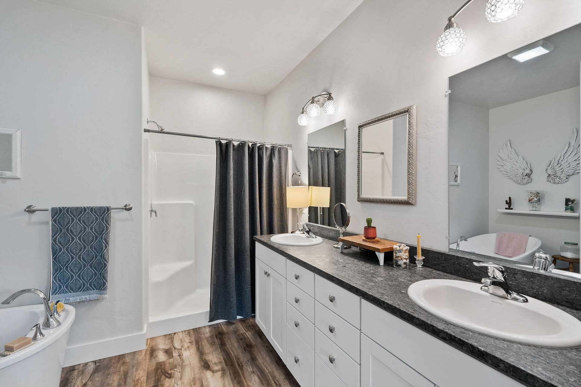 13404 Crescent Moon Drive, Bigfork, MT 59911 Luxurious primary ensuite bathroom boasting a long dual vanity, soaking tub and standalone shower