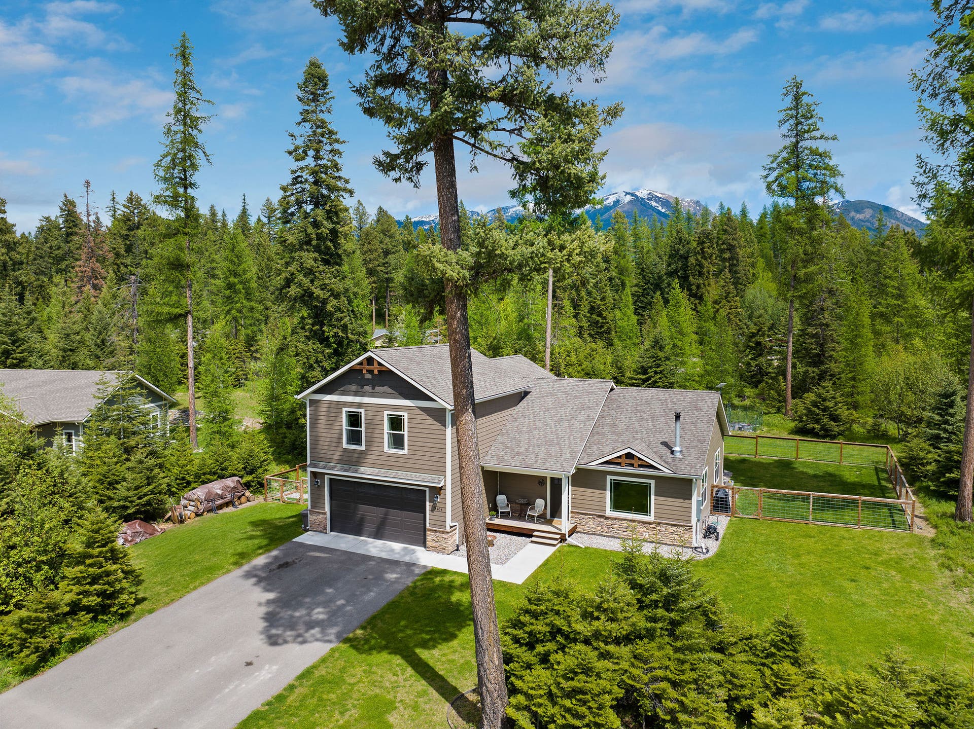 13404 Crescent Moon Drive, Bigfork, MT 59911 Aerial perspective highlighting the majestic mountain backdrop