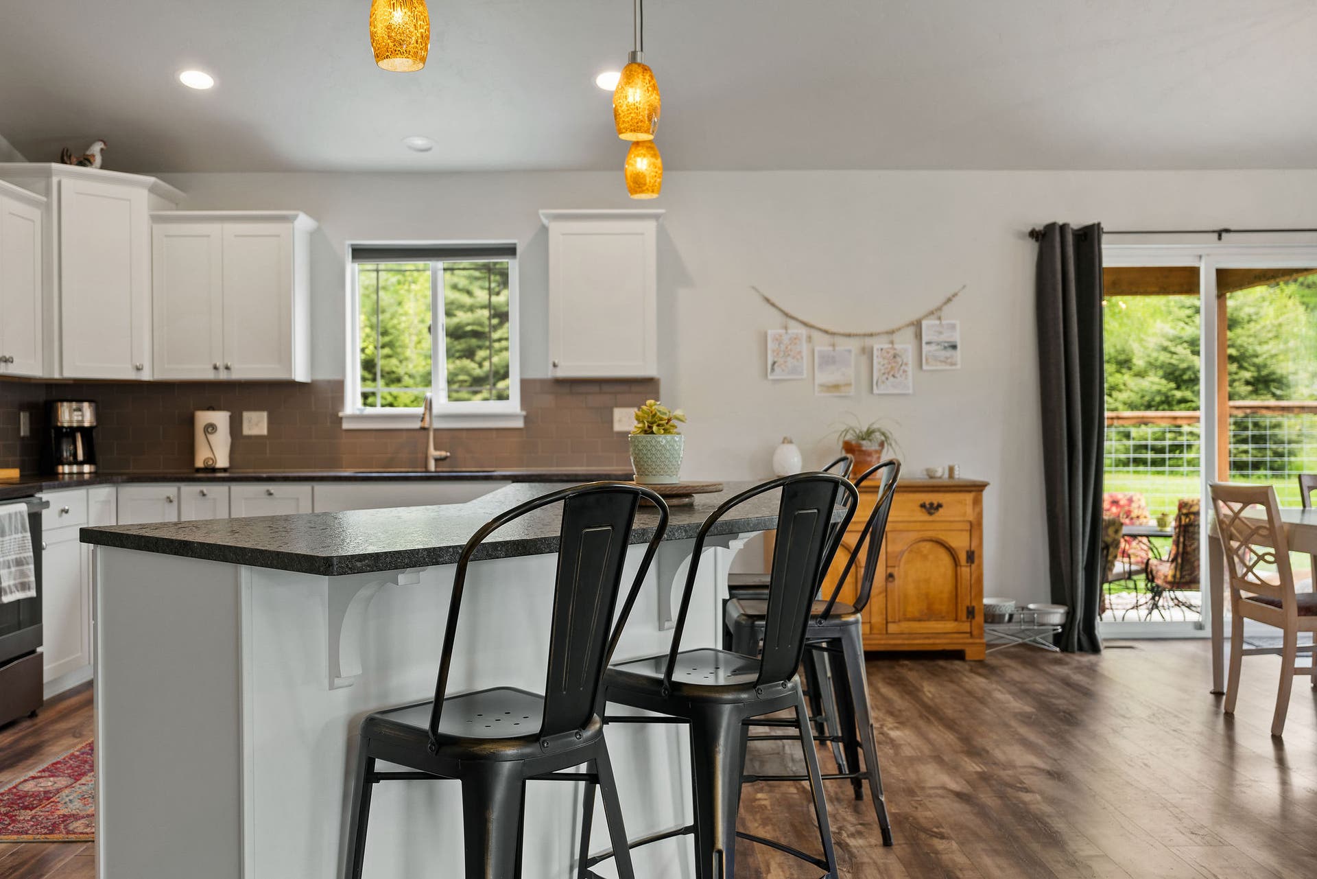 13404 Crescent Moon Drive, Bigfork, MT 59911 Convenient kitchen breakfast bar with modern pendant lighting and counter seating