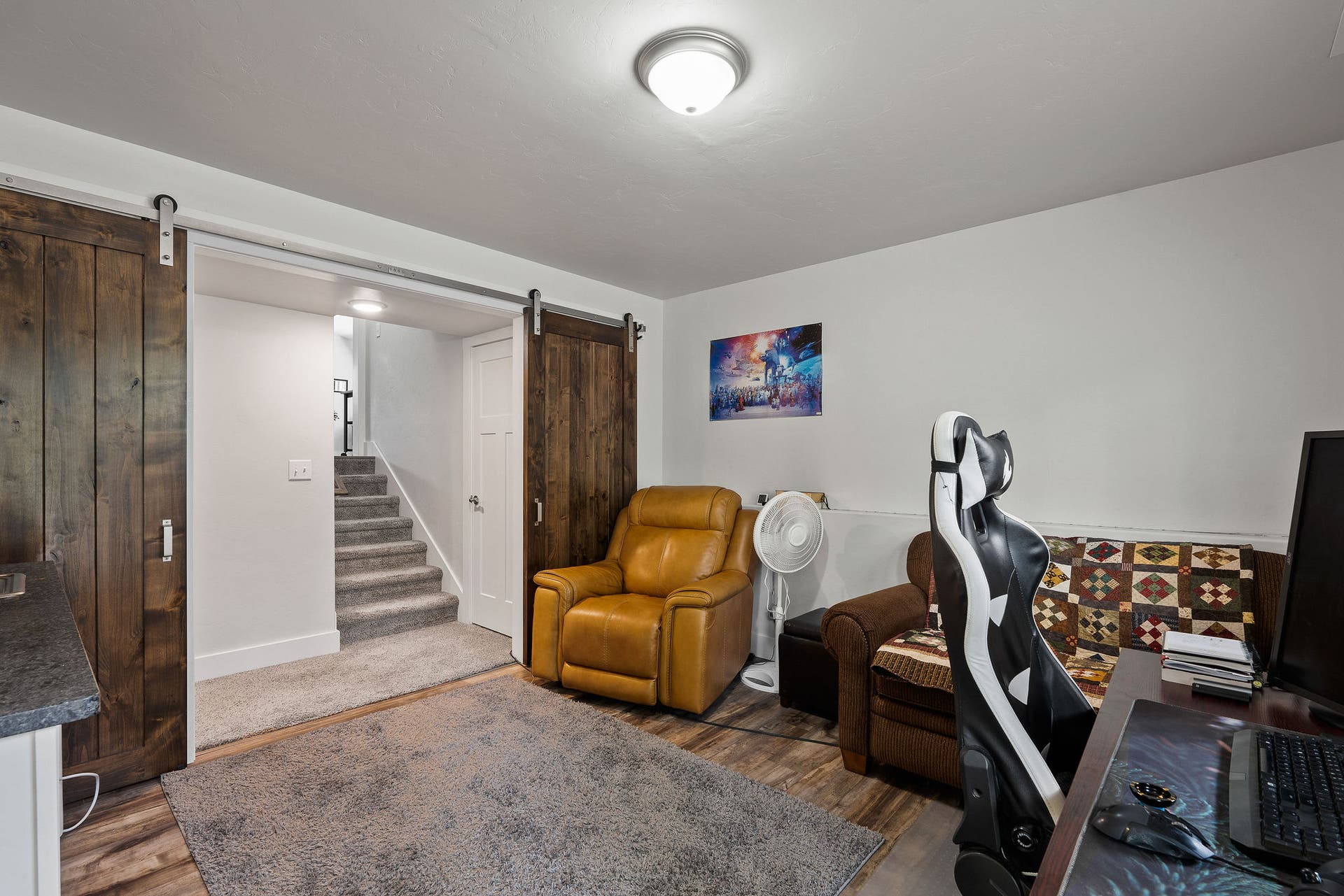 13404 Crescent Moon Drive, Bigfork, MT 59911 Lower-level multi-purpose space featuring stylish rustic barn doors