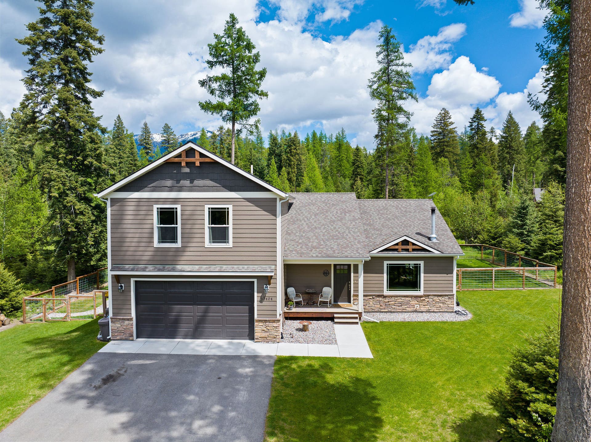 13404 Crescent Moon Drive, Bigfork, MT 59911 Charming multi-level home nestled on a 0.63-acre lot