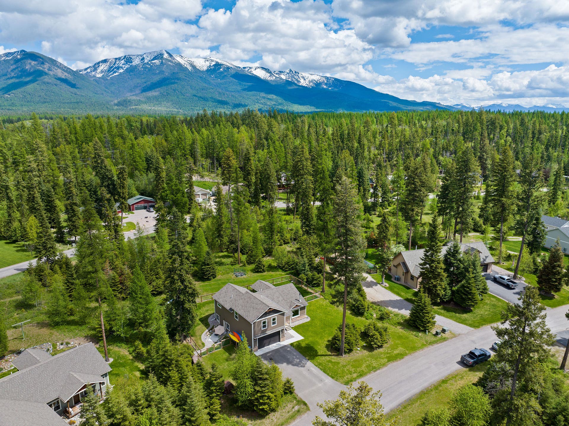 13404 Crescent Moon Drive, Bigfork, MT 59911 Aerial neighborhood view looking West with the Swan Mountain Range in the background
