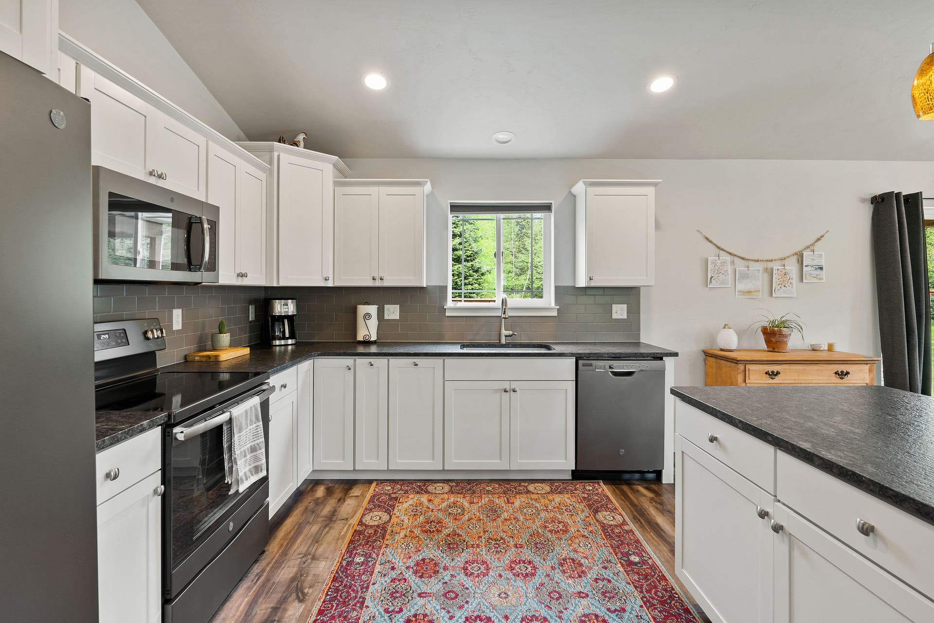 13404 Crescent Moon Drive, Bigfork, MT 59911 Beautifully appointed kitchen with a sink window overlooking the peaceful yard