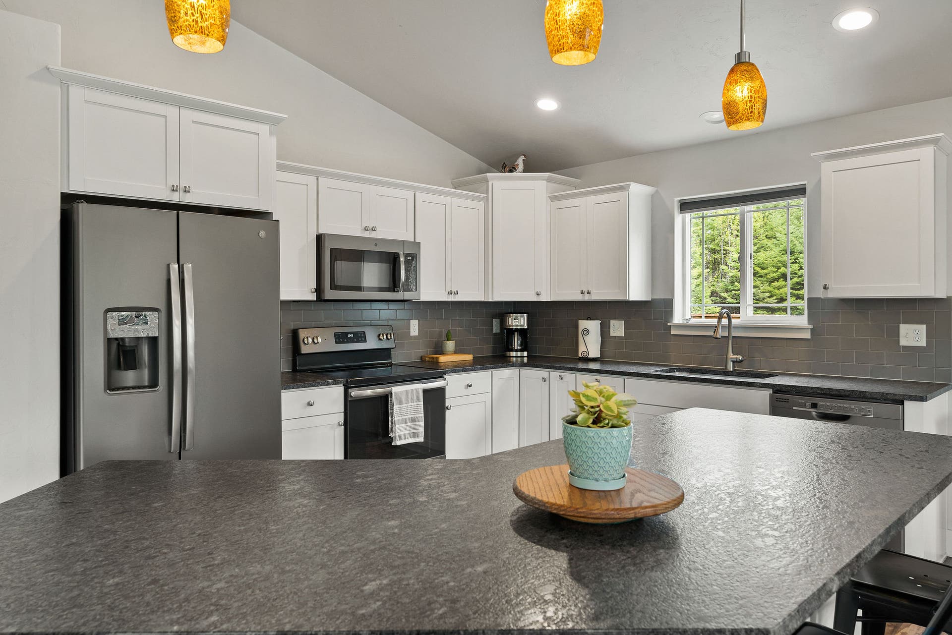 13404 Crescent Moon Drive, Bigfork, MT 59911 Fully equipped kitchen featuring premium stainless steel appliances and ample workspace