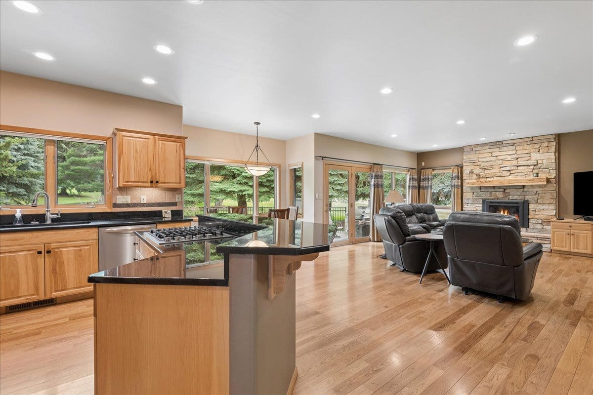 View from kitchen toward living room with natural gas fireplace