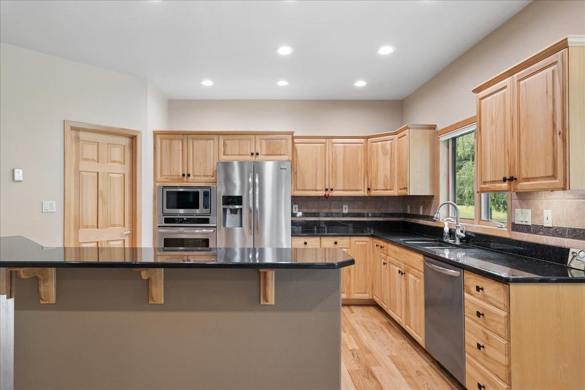 Kitchen with granite countertops and eating bar