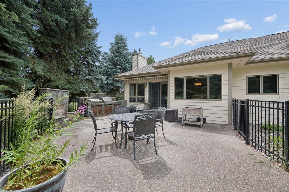 Backyard patio with gas fireplace and built-in gas bbq