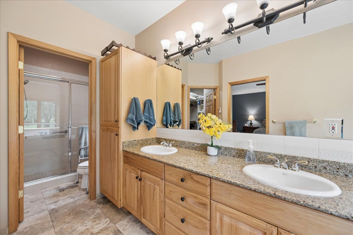 Heated tile floors and dual sinks in the master bathroom