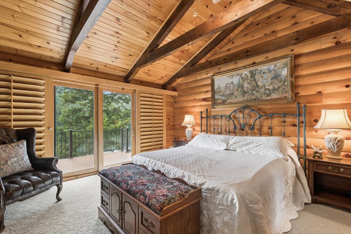 14529 Sunburst Drive, Bigfork, MT 59911 Bedroom with door to upper deck