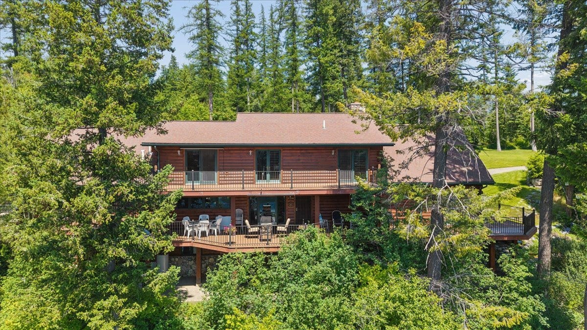 14529 Sunburst Drive, Bigfork, MT 59911 Back of home with 2 wrap-around decks