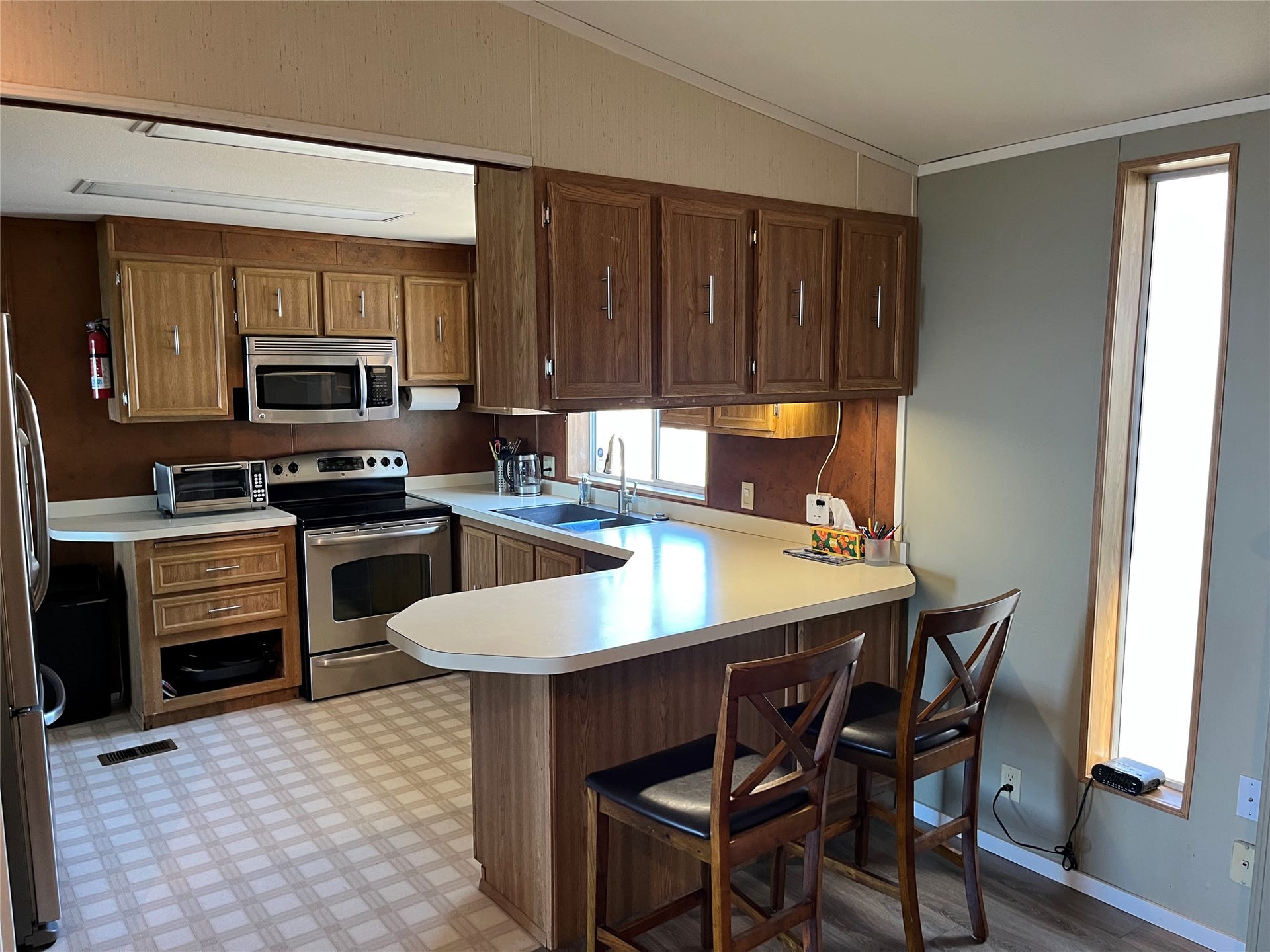 15335 MT Highway 35, Bigfork, MT 59911 Second home kitchen with stainless steel appliances