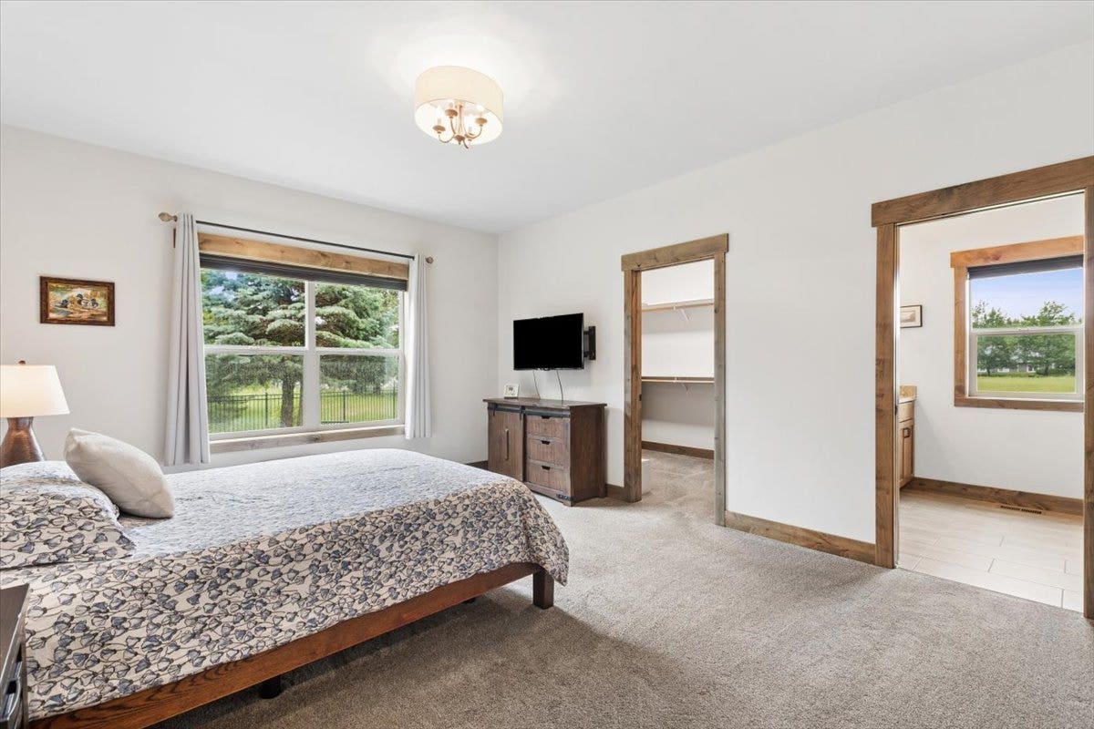 236 Bluebunch Court, Bigfork, MT 59911 Primary bedroom with private bath and walk-in closet