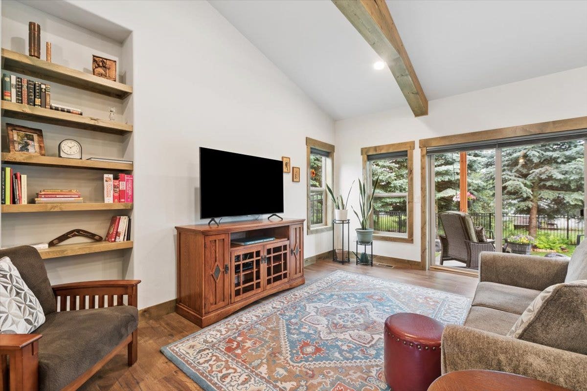 236 Bluebunch Court, Bigfork, MT 59911 Living room with large windows to the private back yard