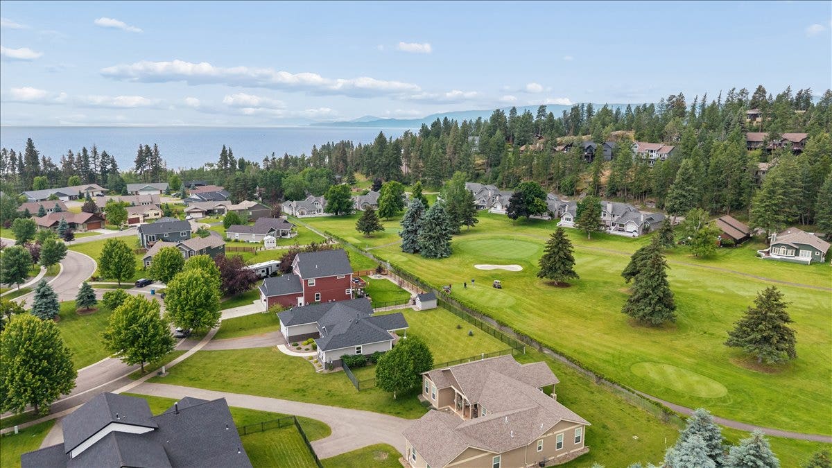 615 Mill Pond Place, Bigfork, MT 59911 Tee off at Eagle Bend Golf Course hole #8