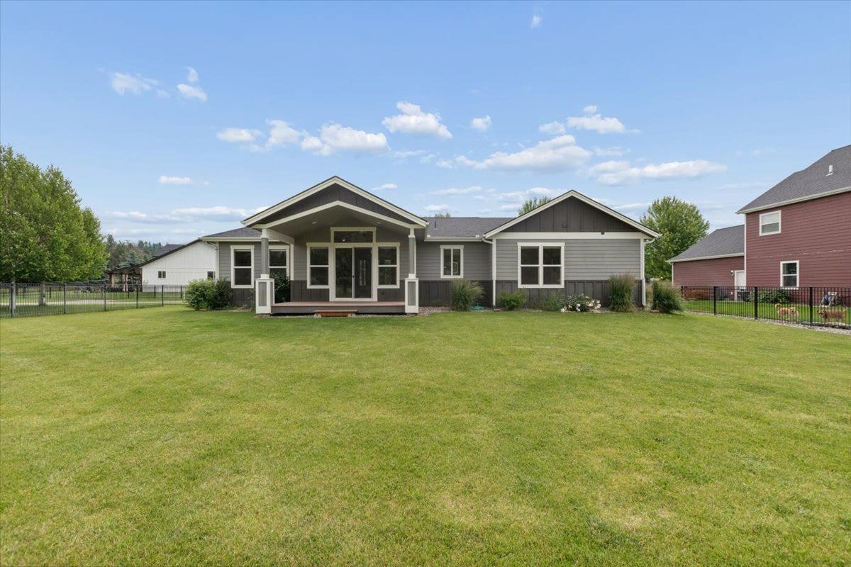 615 Mill Pond Place, Bigfork, MT 59911 Back yard and covered patio