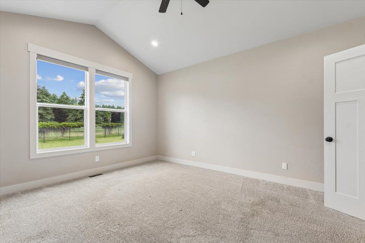 615 Mill Pond Place, Bigfork, MT 59911 Primary bedroom with windows to the back yard