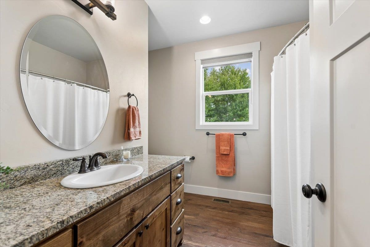 615 Mill Pond Place, Bigfork, MT 59911 Guest bathroom with tub and shower
