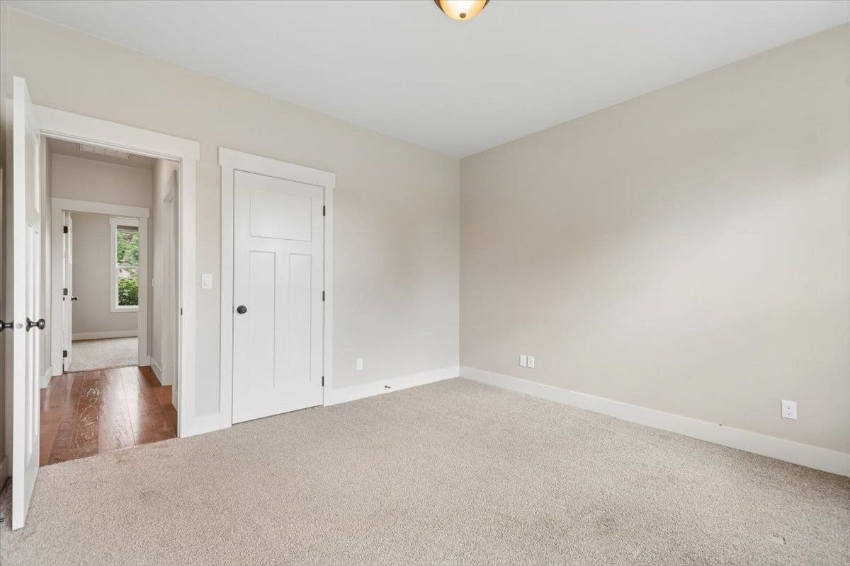 615 Mill Pond Place, Bigfork, MT 59911 Guest bedroom #1 looking toward bathroom and guest bedroom #2