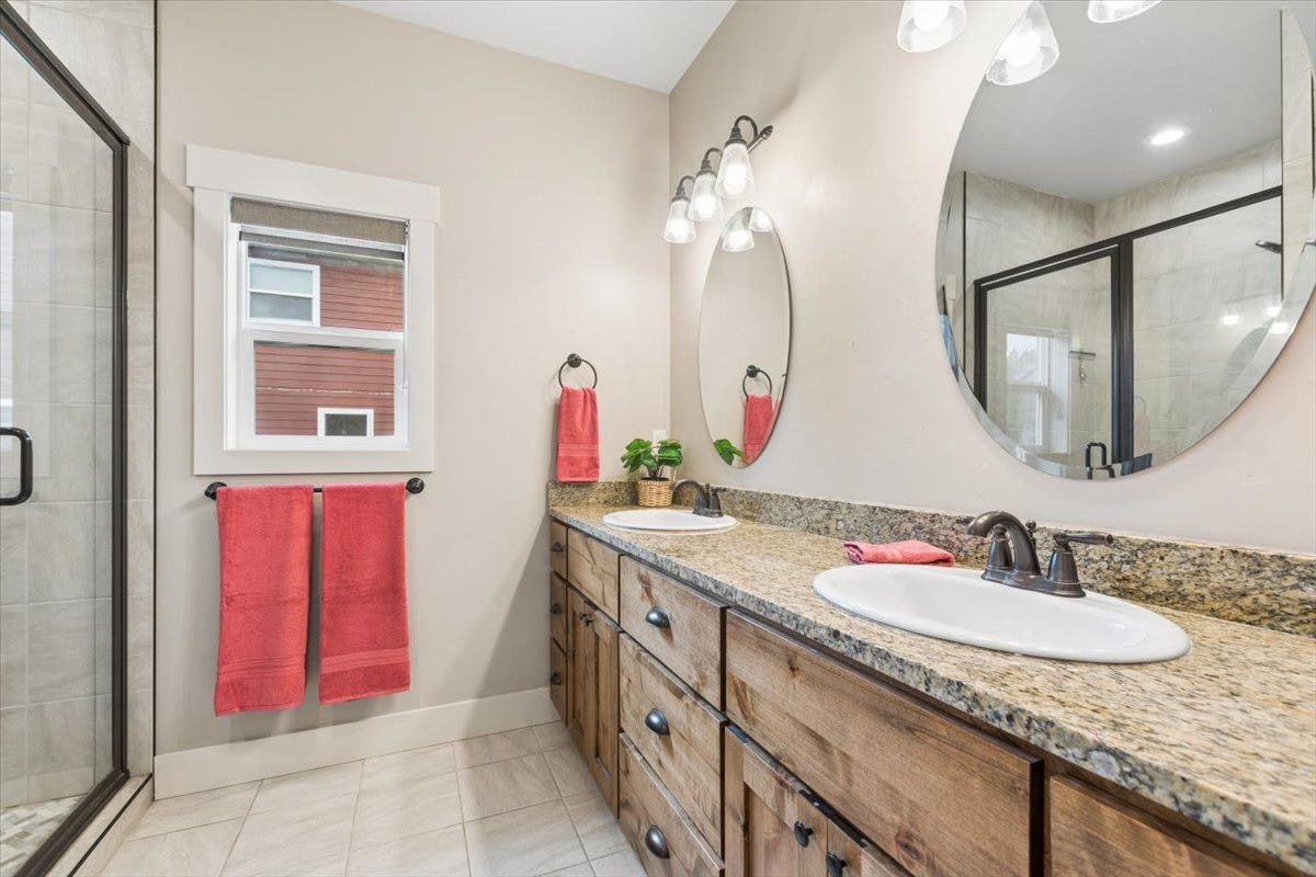 615 Mill Pond Place, Bigfork, MT 59911 Primary bathroom with double sinks and shower