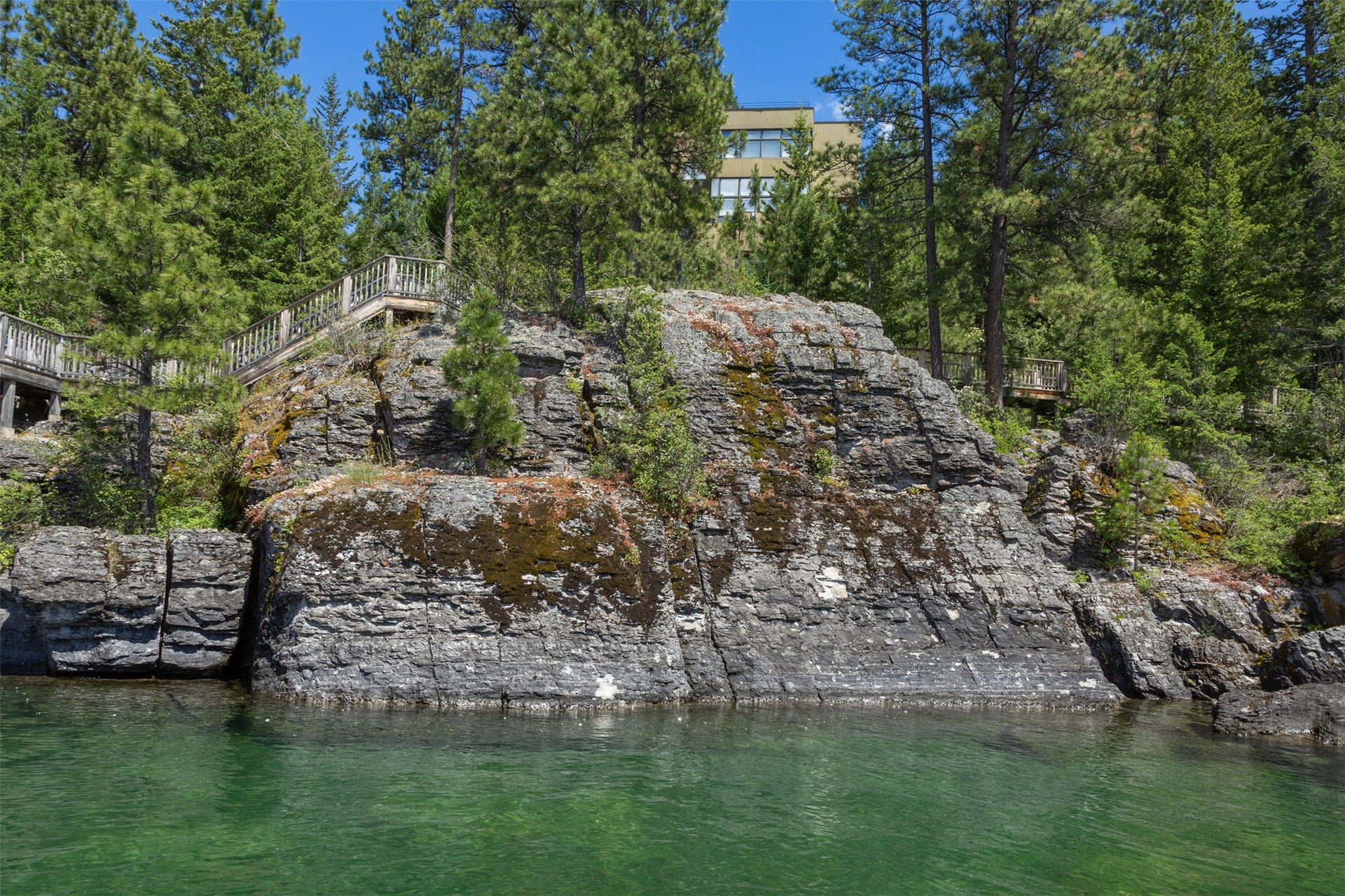 The natural glaciated rock landscape is the hallmark of this amazing property!