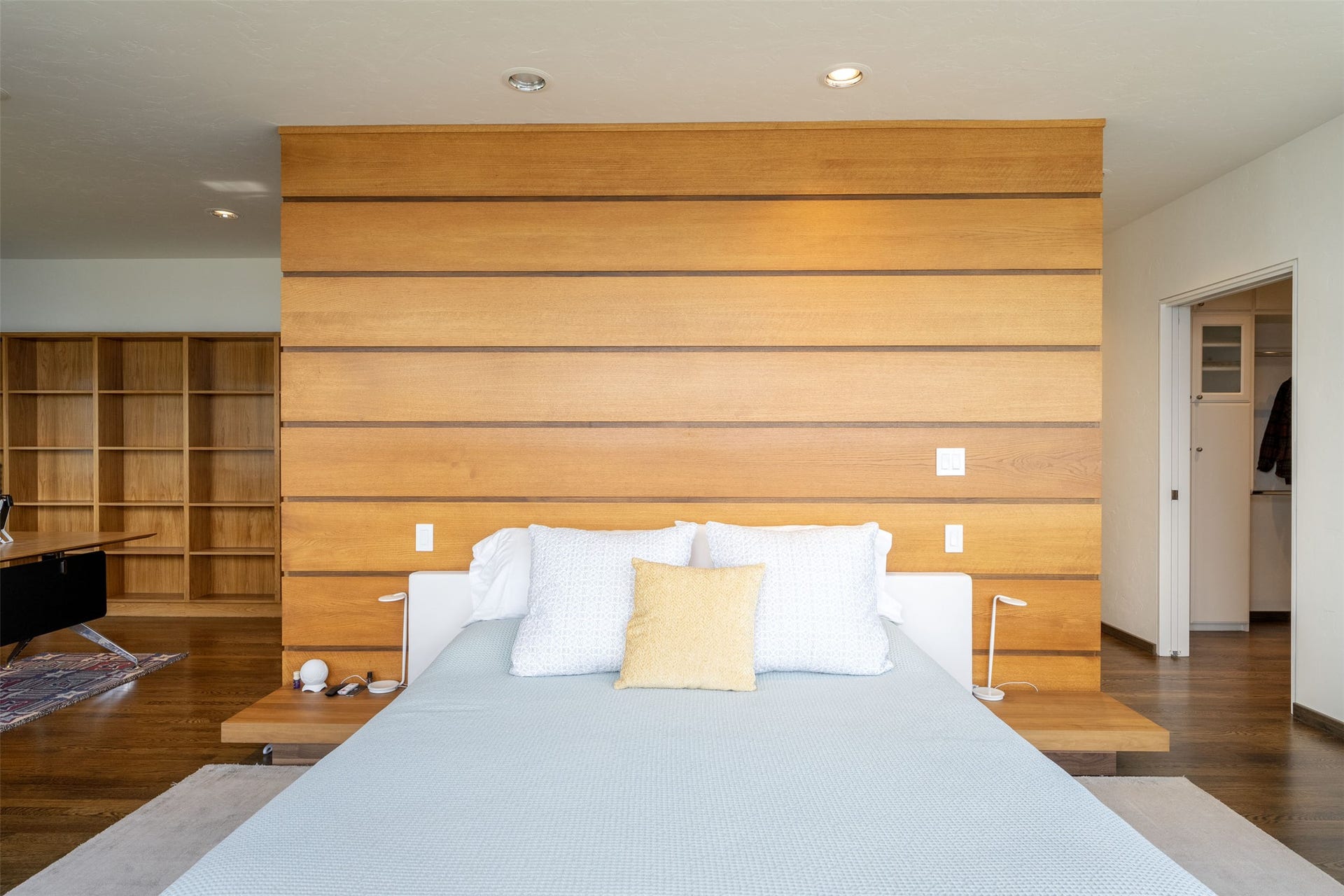 Clear fir accent wall in primary bedroom.
