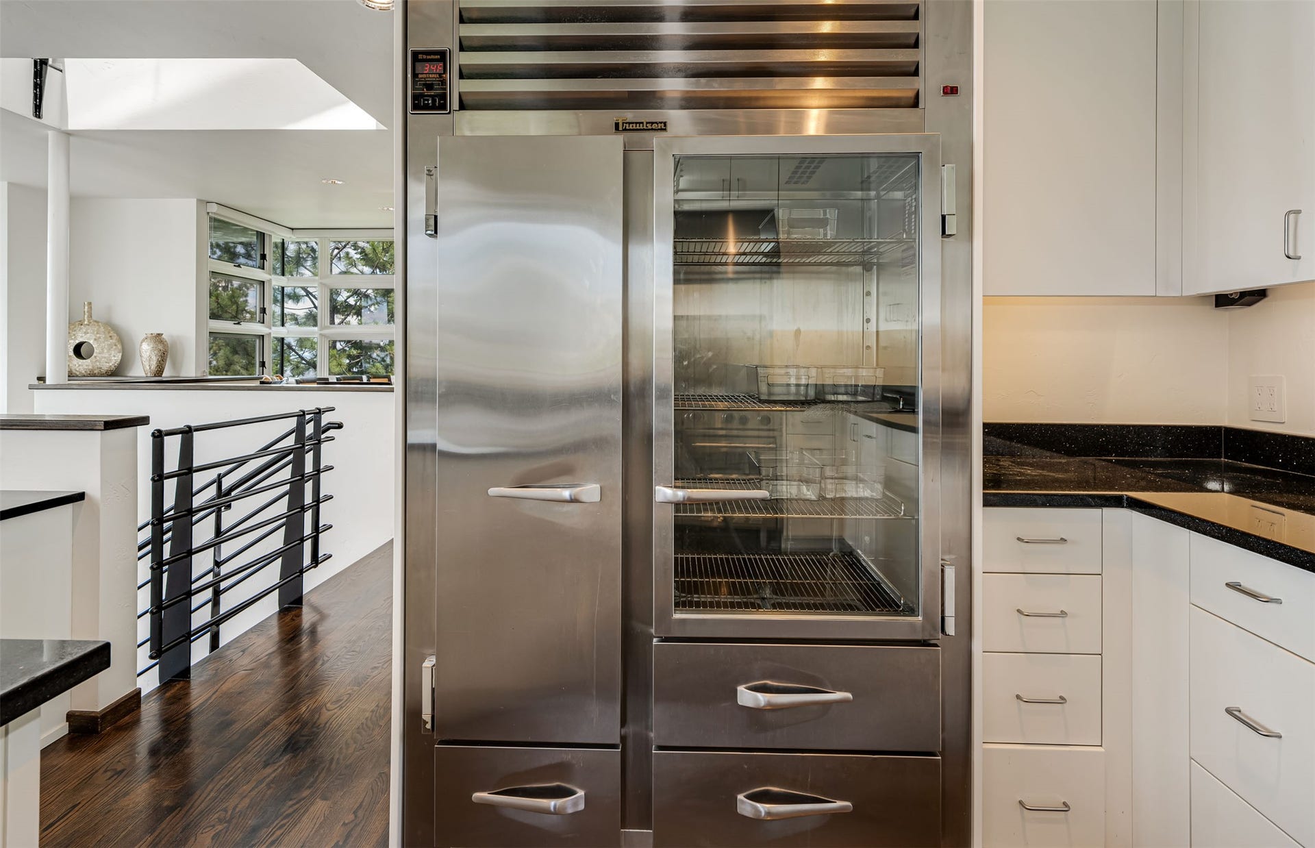A commercial Traulson freezer / refrigerator placed for maximum efficiency in meal preparation