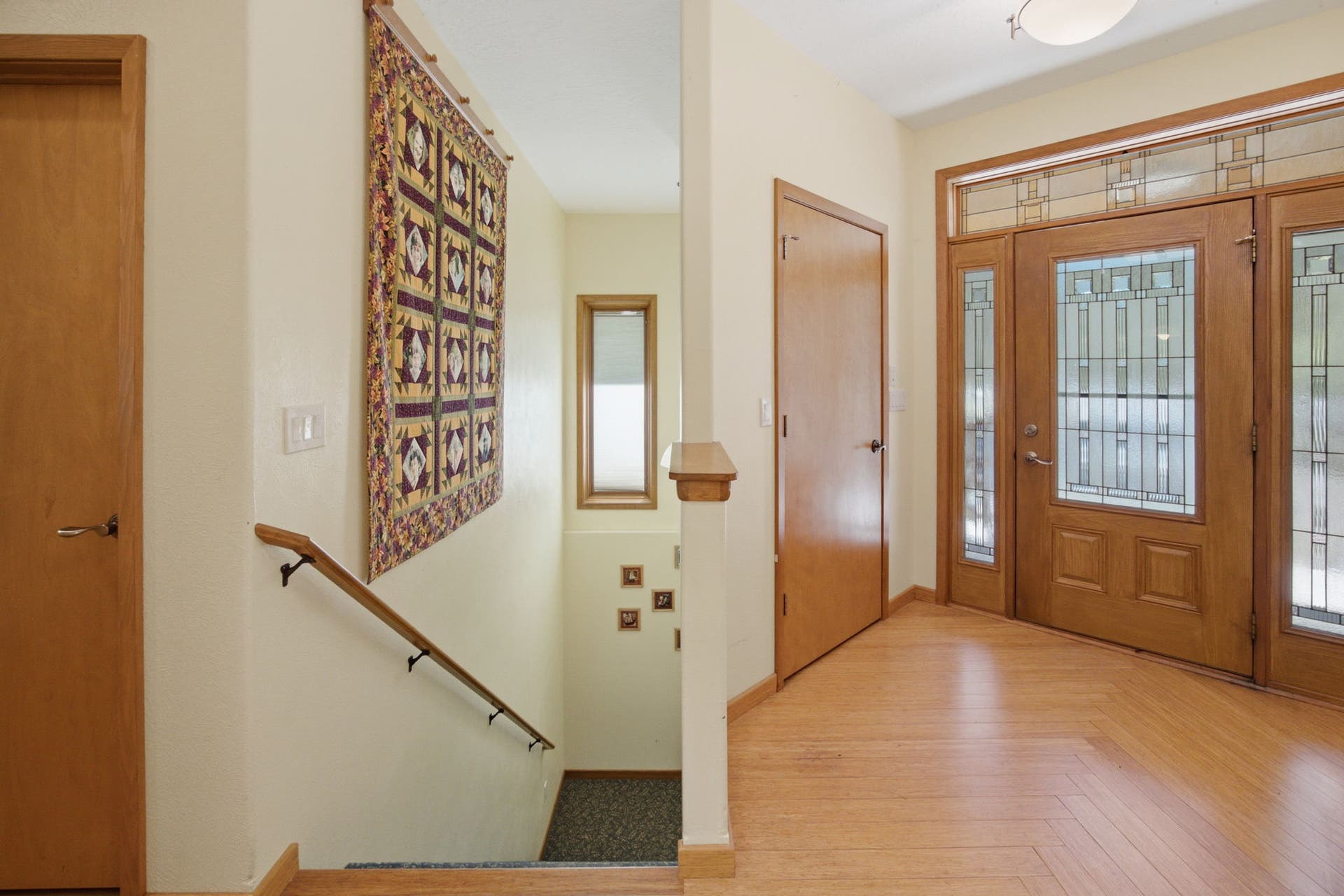 The spacious entry foyer offers an open, functional layout with easy access to the main living areas. Natural light, quality finishes, and a graceful staircase create an inviting sense of arrival.